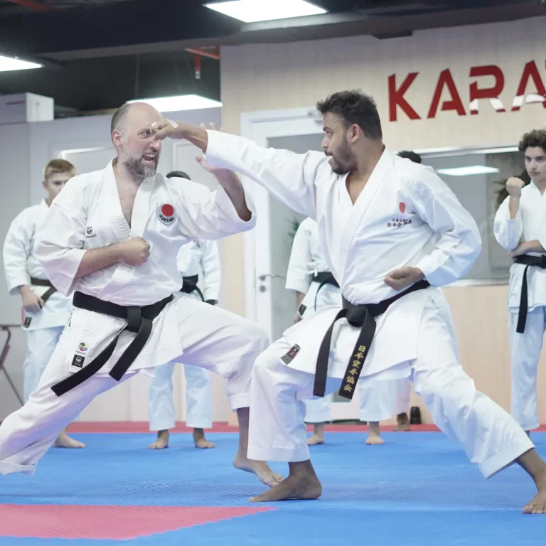 Adults training together during a karate class at the Dubai Silicon Oasis branch