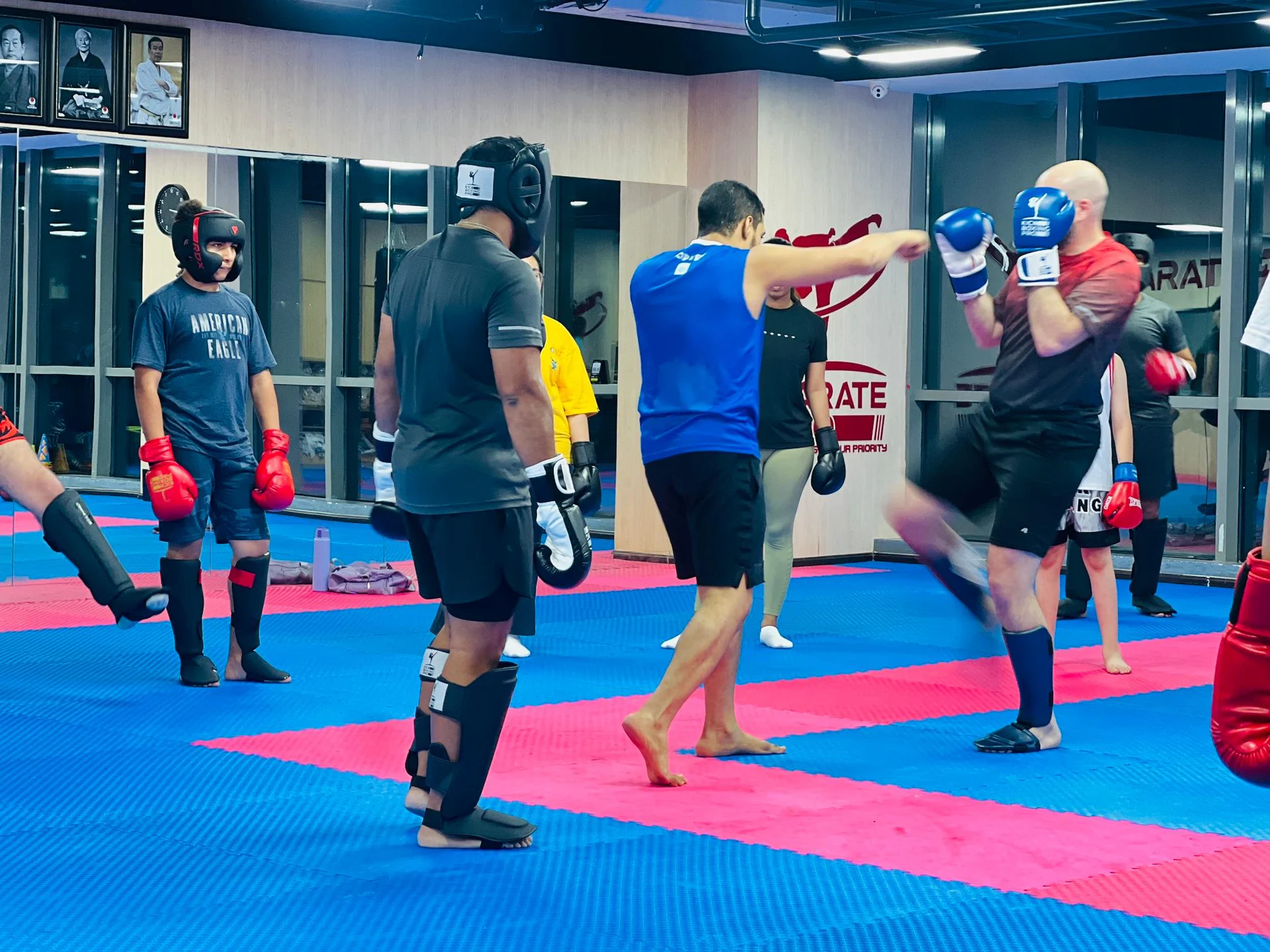 Adults training together during a kickboxing class