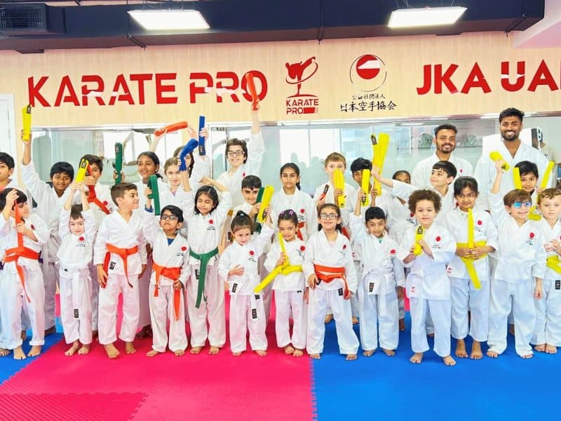 Group photo of kids at summer karate camp