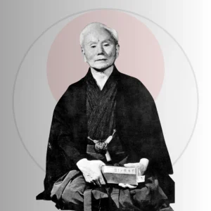 Sensei Gichin Funakoshi, founder of Shotokan karate-do, seated in traditional dress
